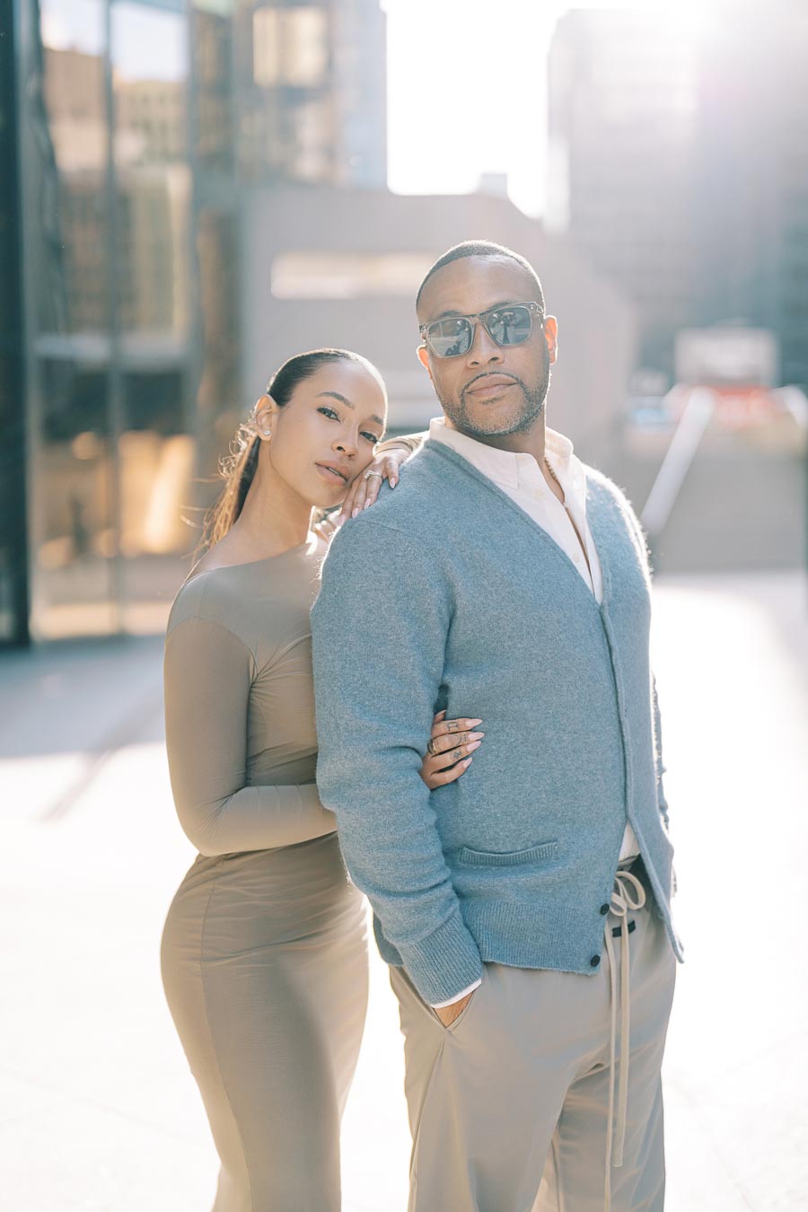 DeVon Franklin and Maria Castillo posing confidently during a modern downtown Toronto engagement session