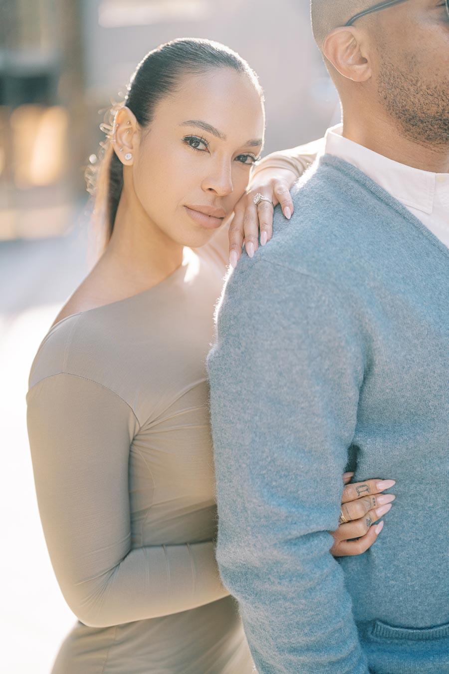 Maria Castillo resting her hand with engagement ring on DeVon Franklin’s shoulder during their Toronto engagement shoot