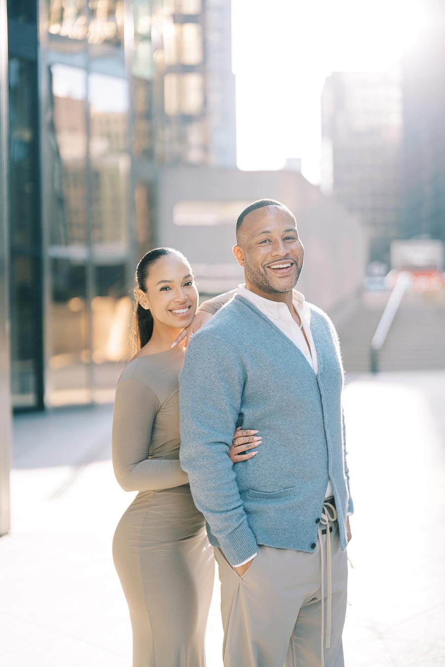 Smiling DeVon Franklin and Maria Castillo during a joyful moment in their downtown Toronto engagement session