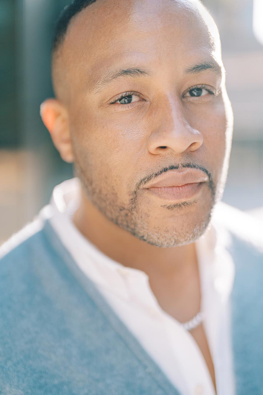 Close-up portrait of DeVon Franklin during a downtown Toronto engagement photoshoot in natural light