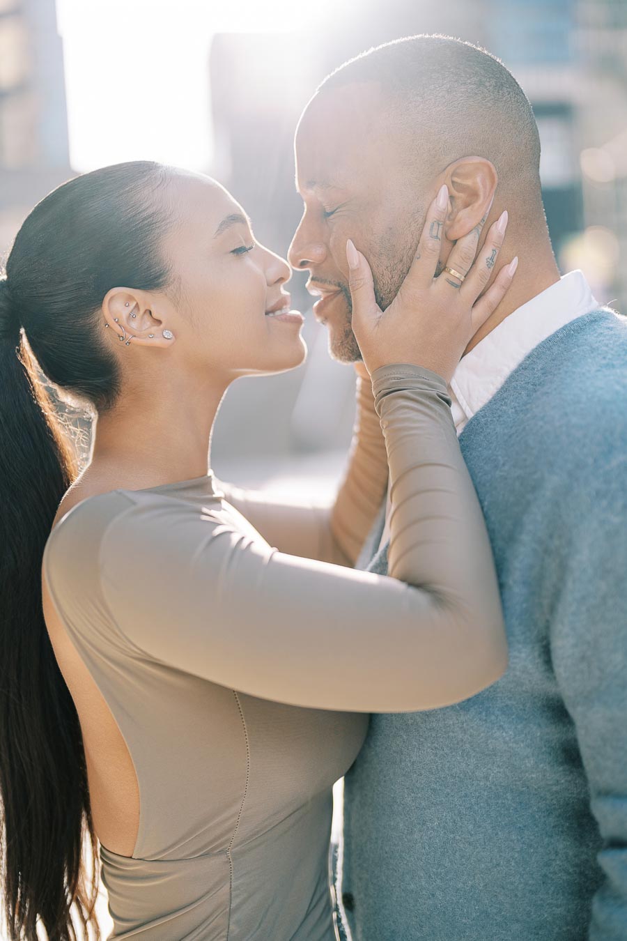 Romantic moment between DeVon Franklin and Maria Castillo during their Toronto engagement photoshoot at sunset