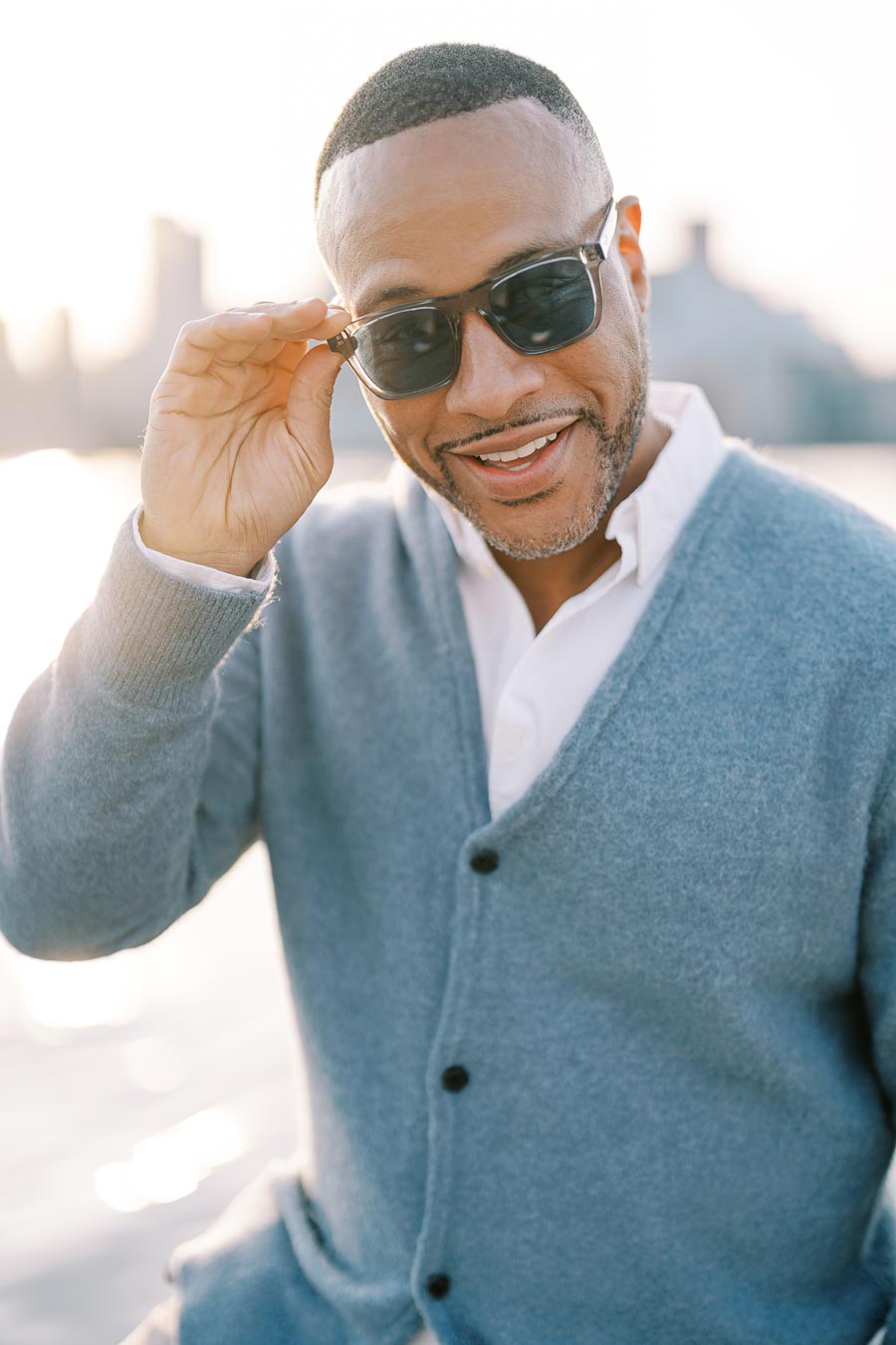 Smiling groom-to-be during Toronto engagement session by the water
