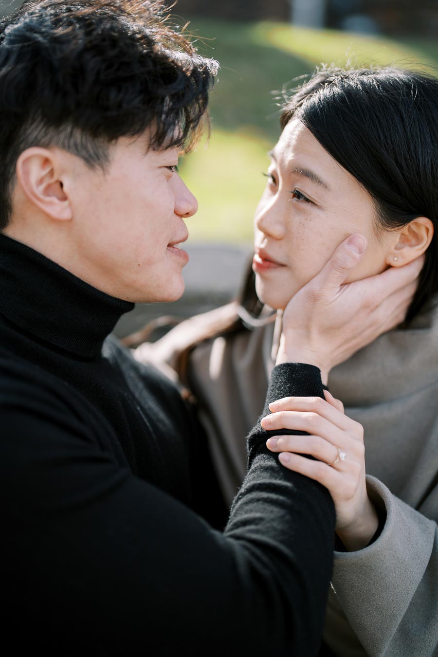 A tender moment between a couple as they gaze into each other's eyes, showcasing affection and connection.