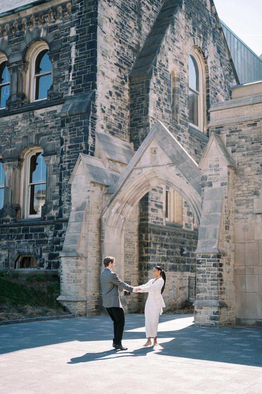 Cecilia and Julian posing at their engagement session at the University of Toronto