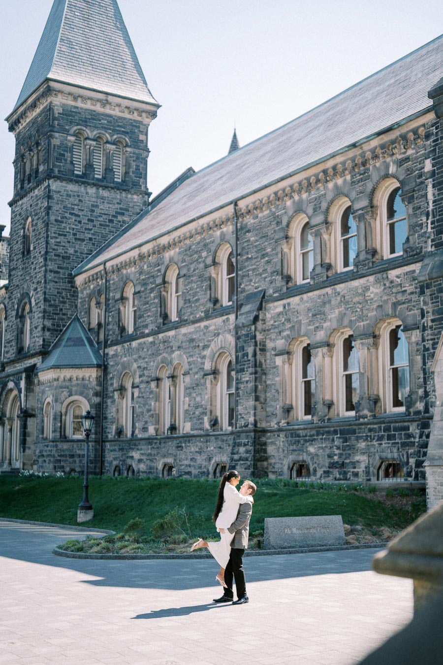 Cecilia and Julian posing during their engagement session at the University of Toronto.