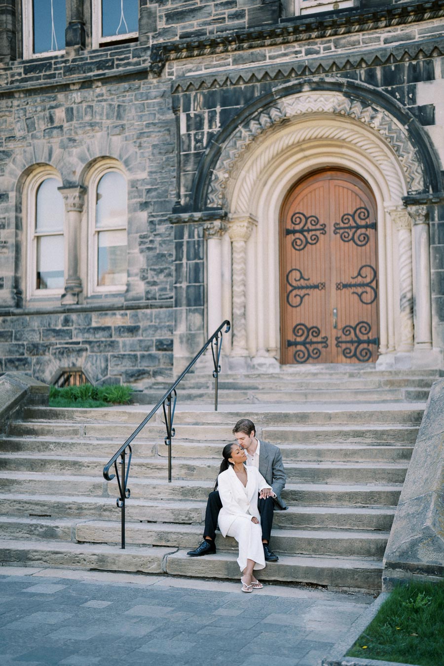 Cecilia and Julian posing for their engagement session at the University of Toronto.