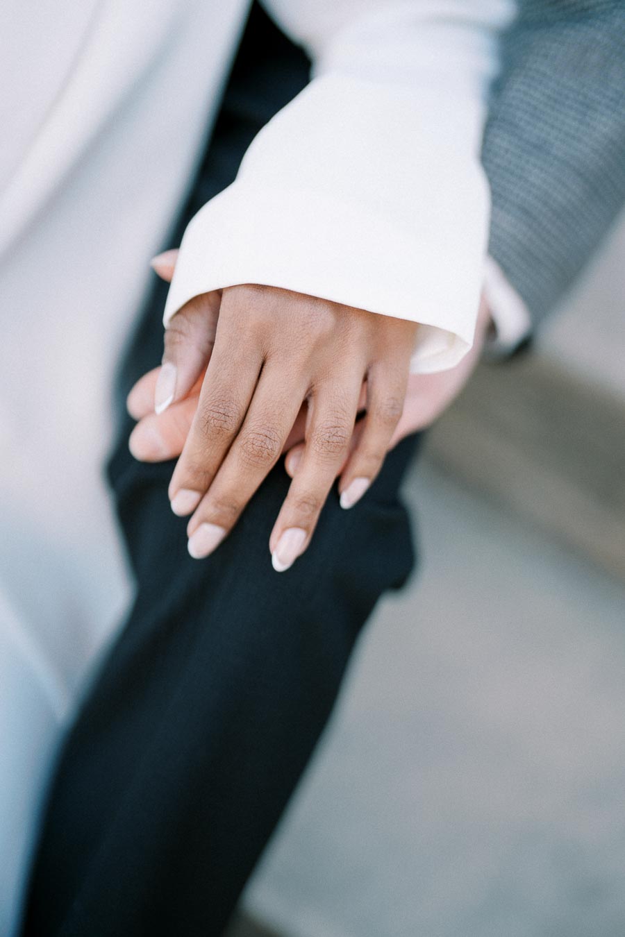 Close-up of two clasped hands, emphasizing connection and trust.