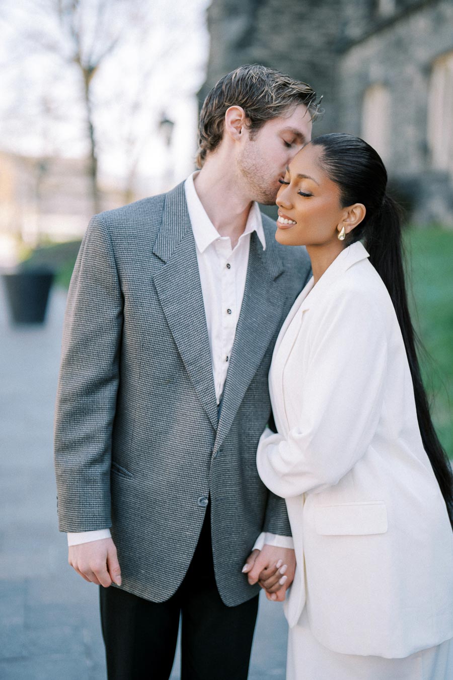 Cecilia and Julian posing for their engagement session at the University of Toronto