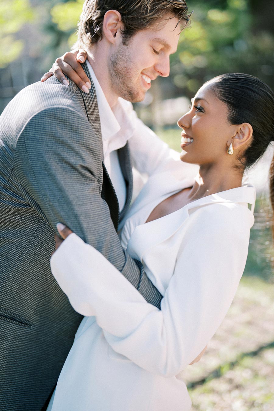 Close-up of engaged couple smiling at each other during spring photoshoot in Toronto