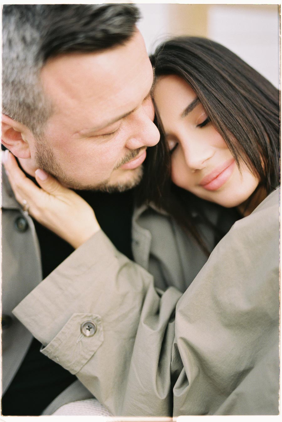 A tender moment captured between a couple, showcasing their affection and closeness.