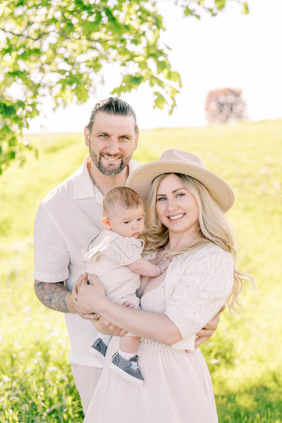 A happy family enjoying a sunny day in the park, capturing a moment of togetherness and joy.
