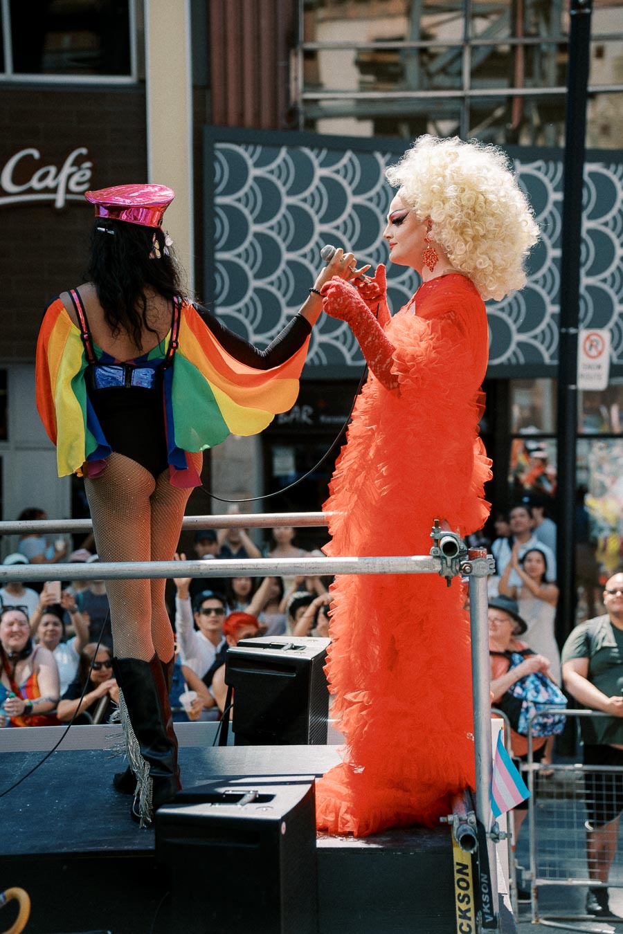 Performers at a pride parade, showcasing vibrant costumes and celebrating diversity.
