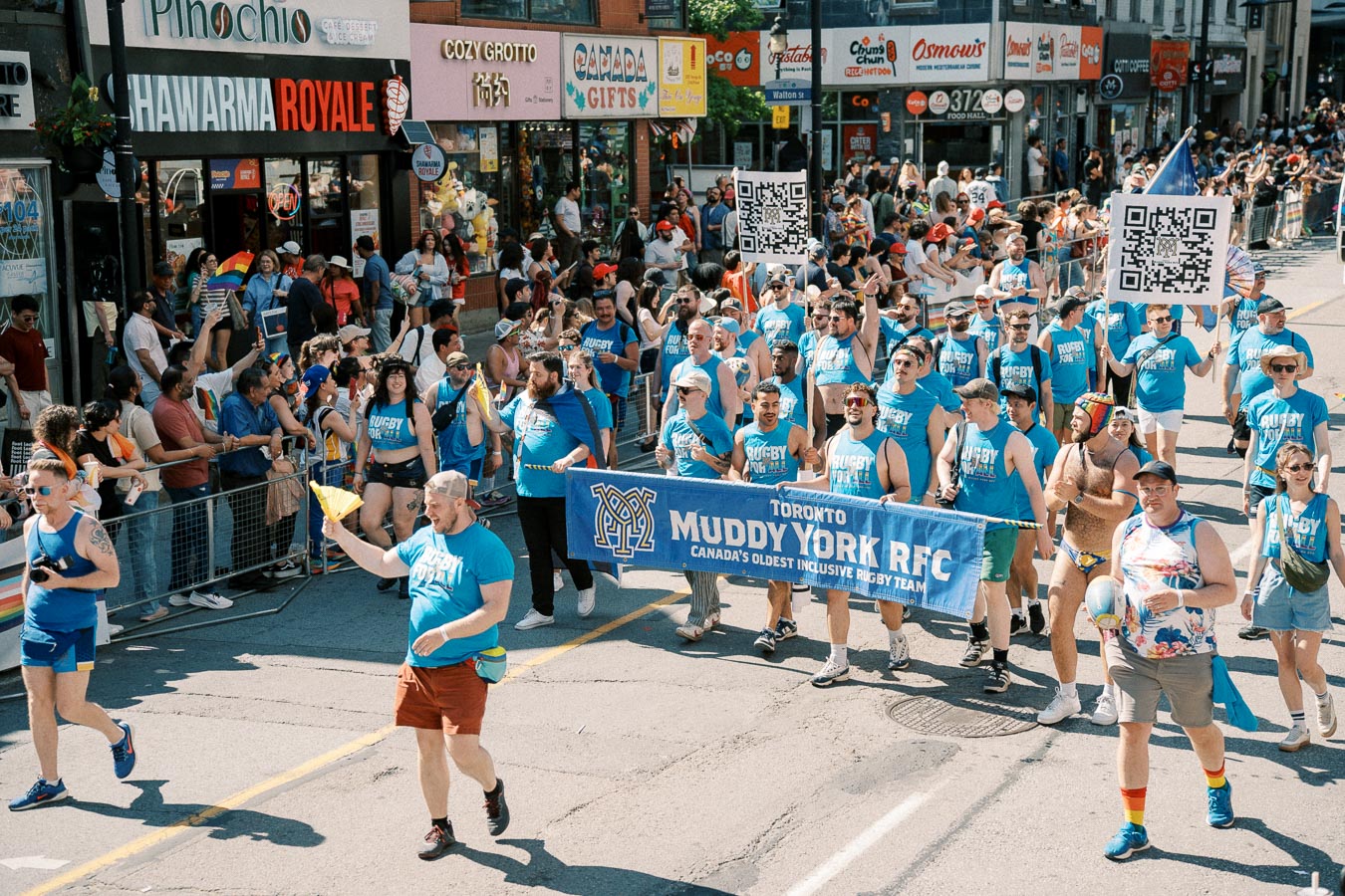 Members of the Toronto Muddy York RFC participate in a parade, showcasing their inclusive rugby team.