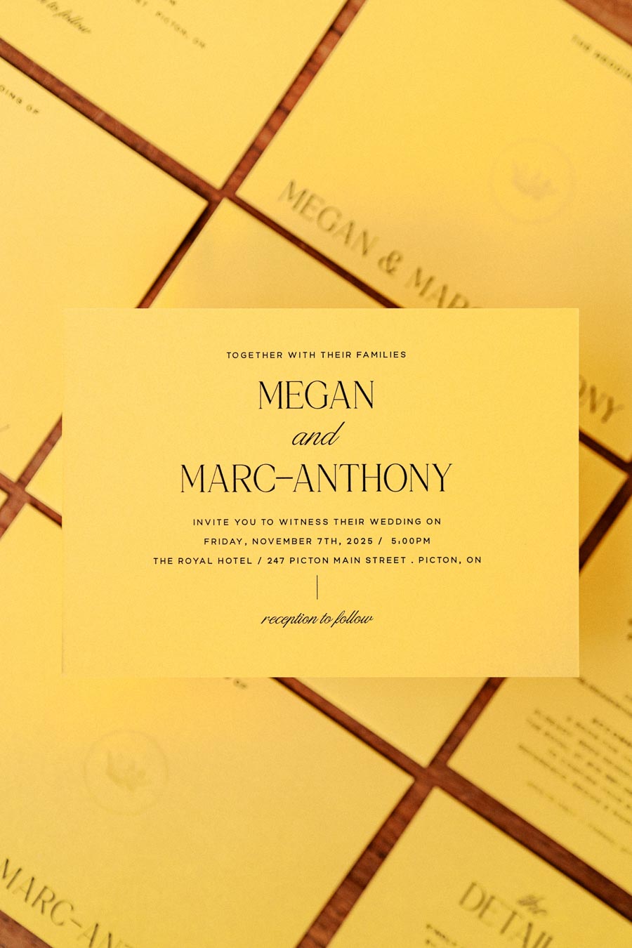 Yellow wedding invitation for Megan and Marc-Anthony's wedding on November 7th, 2025, at The Royal Hotel, Picton, ON.