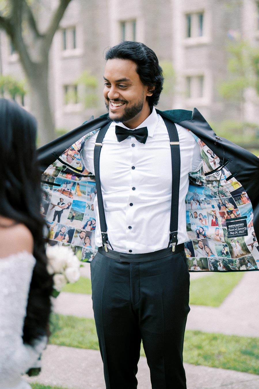 Smiling groom reveals custom tuxedo jacket lining with personal photos during outdoor wedding, showcasing unique and personalized wedding attire.