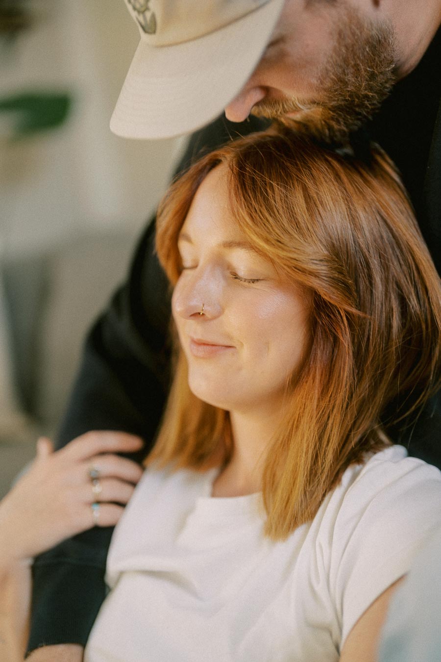 Cozy couple in an intimate, affectionate embrace at home.