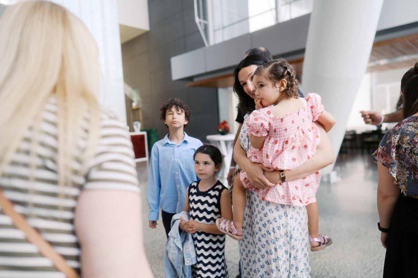 A group of adults and children gather and interact inside The Atrium at Ricarda’s, Toronto, during the Toronto Prep Forever Launch Party event.