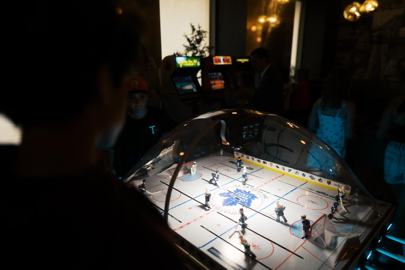 Children playing a bubble hockey arcade game in the kids’ lounge during the Toronto Prep Forever Launch Party at Ricarda’s, Toronto.
