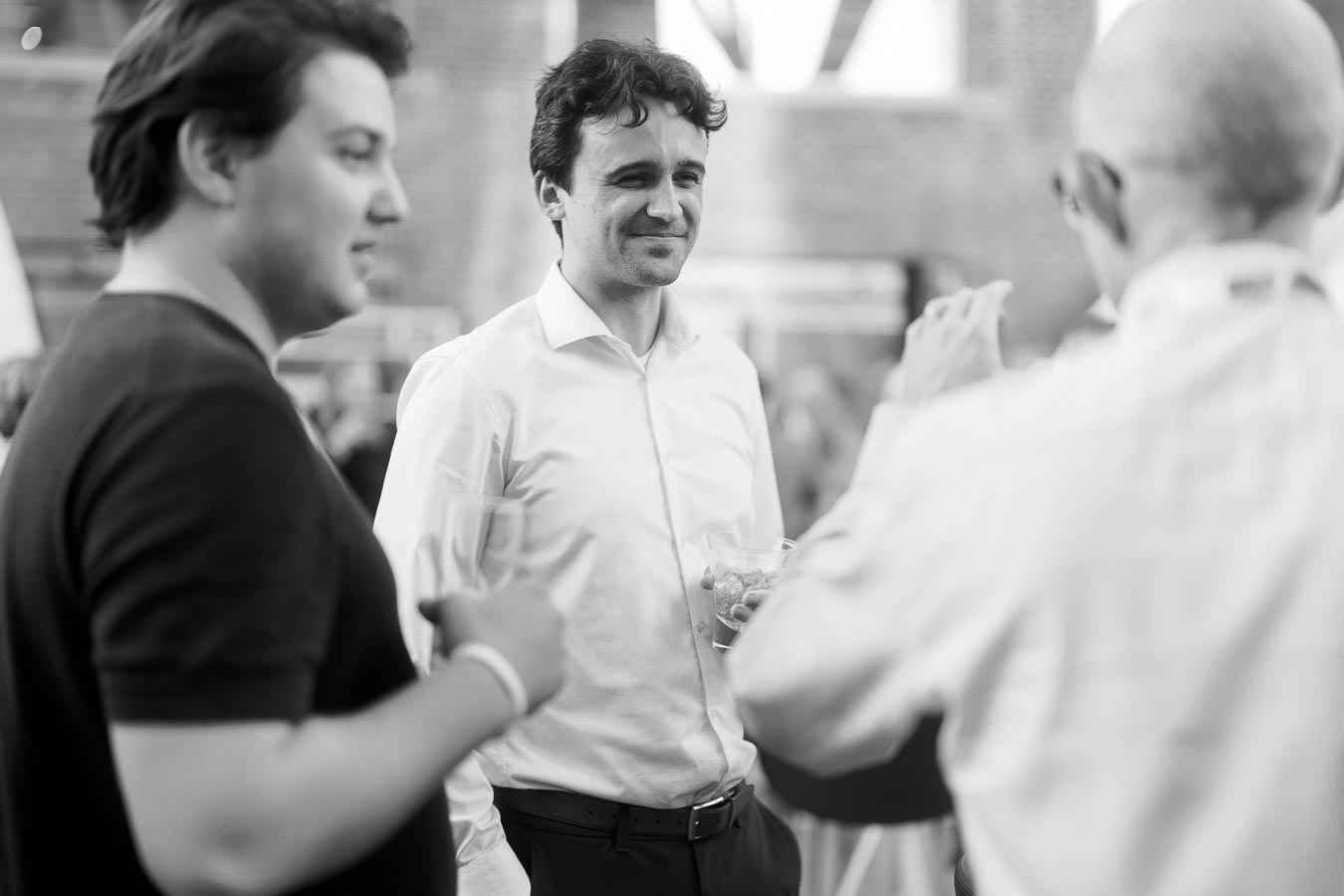 Three guests in conversation, one in a white shirt holding a drink, at the Toronto Prep Forever Launch Party at Ricarda’s in Toronto.