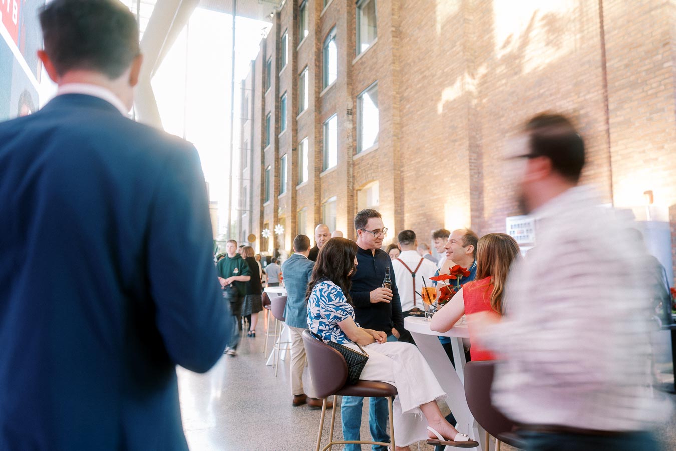 Guests gathered at high-top tables, conversing and enjoying drinks during the Toronto Prep Forever Launch Party at The Atrium at Ricarda’s in Toronto.