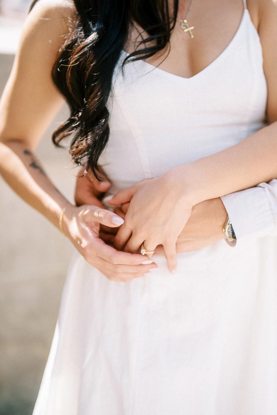 Close-up of Cassie and Gabriel's hands as they embrace, with an engagement ring visible, during an engagement session in Toronto.