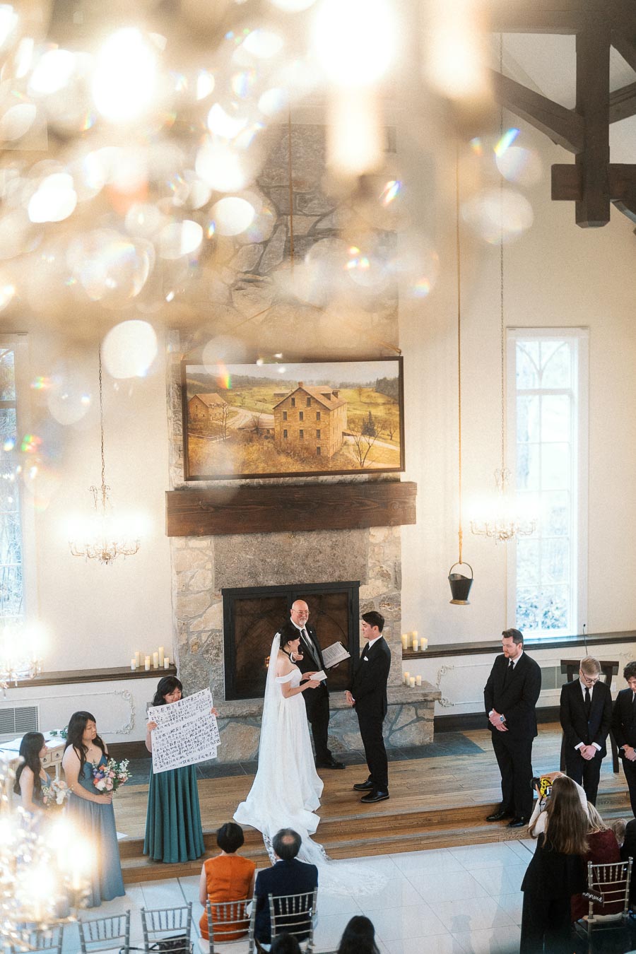 Couple standing at the altar during an indoor wedding ceremony