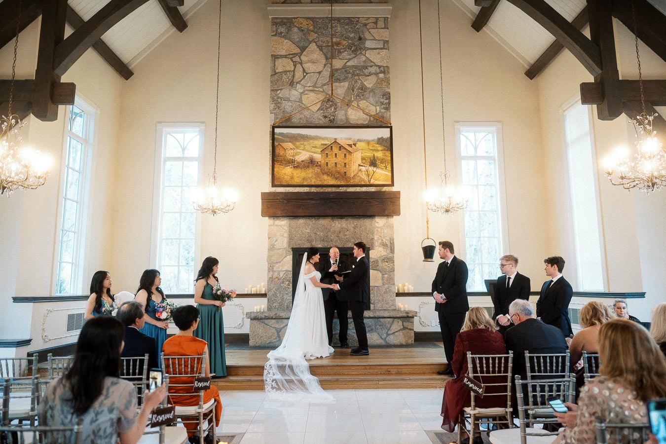 Couple exchanging vows during an indoor wedding ceremony in a chapel-like venue