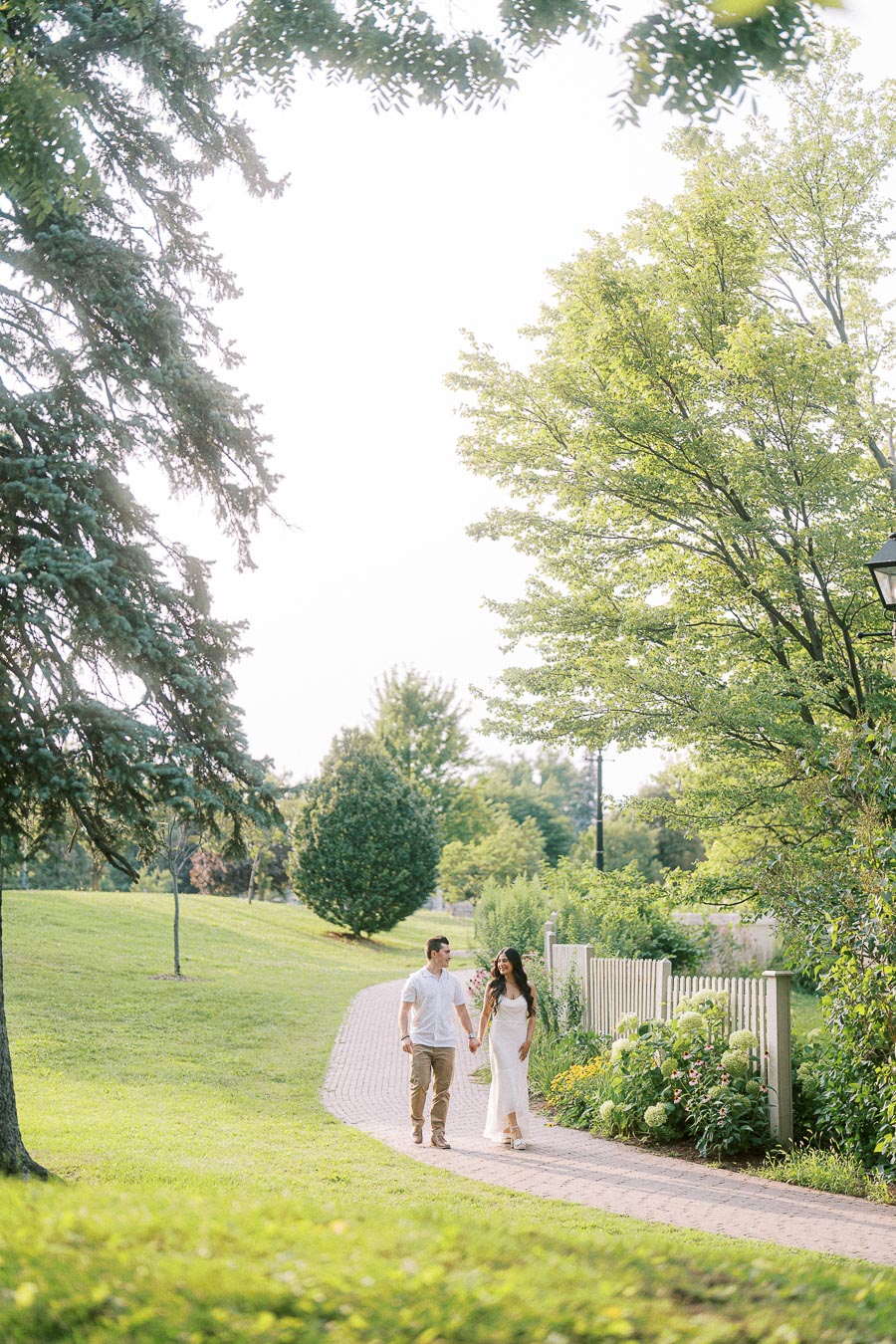 Sumbul and Brian walking on a garden path at Dundurn Castle
