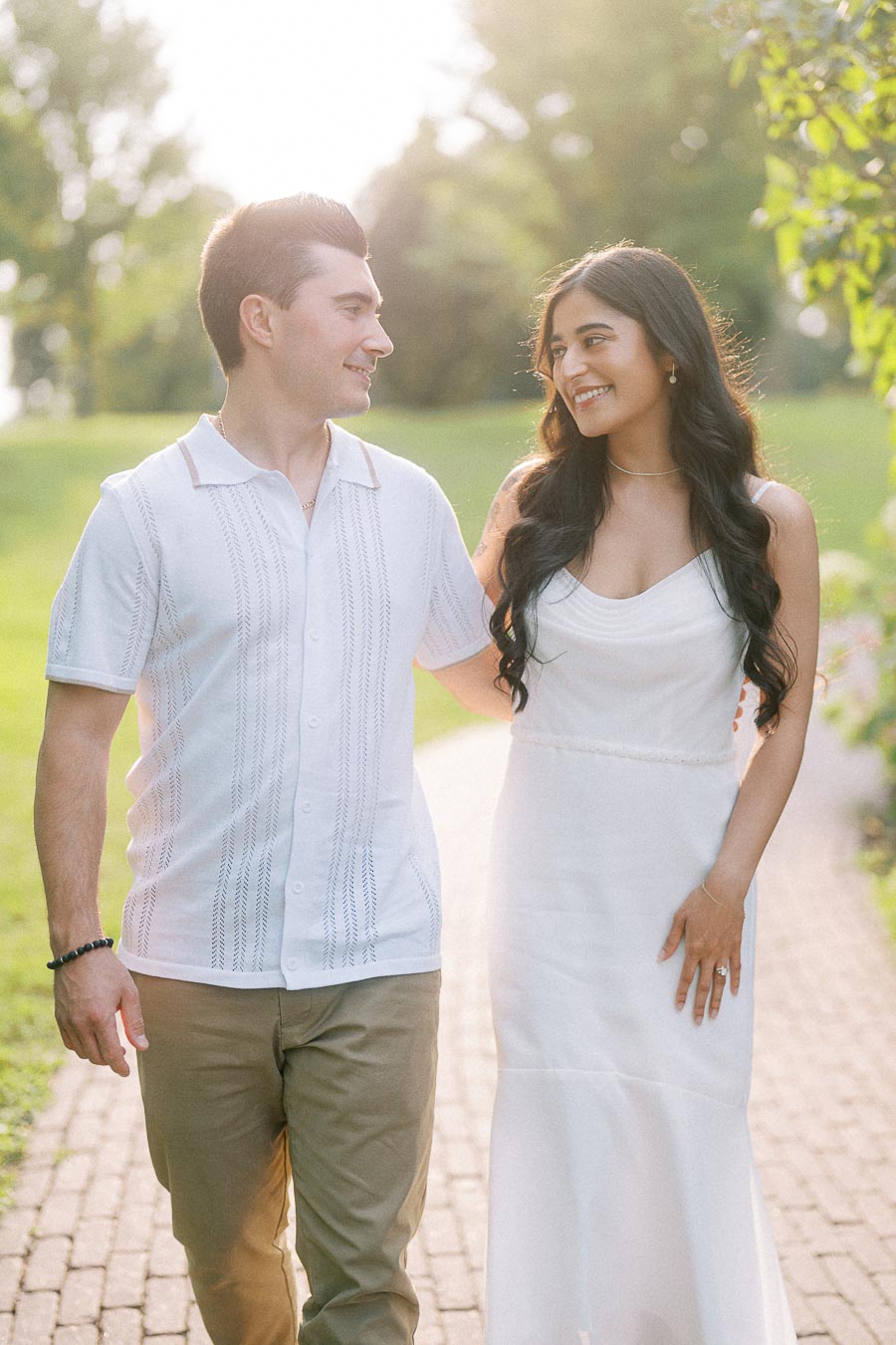 Sumbul and Brian walking on a sunlit path at Dundurn Castle