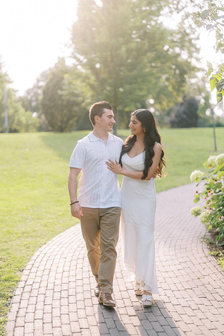 Sumbul and Brian walking on a garden path at Dundurn Castle