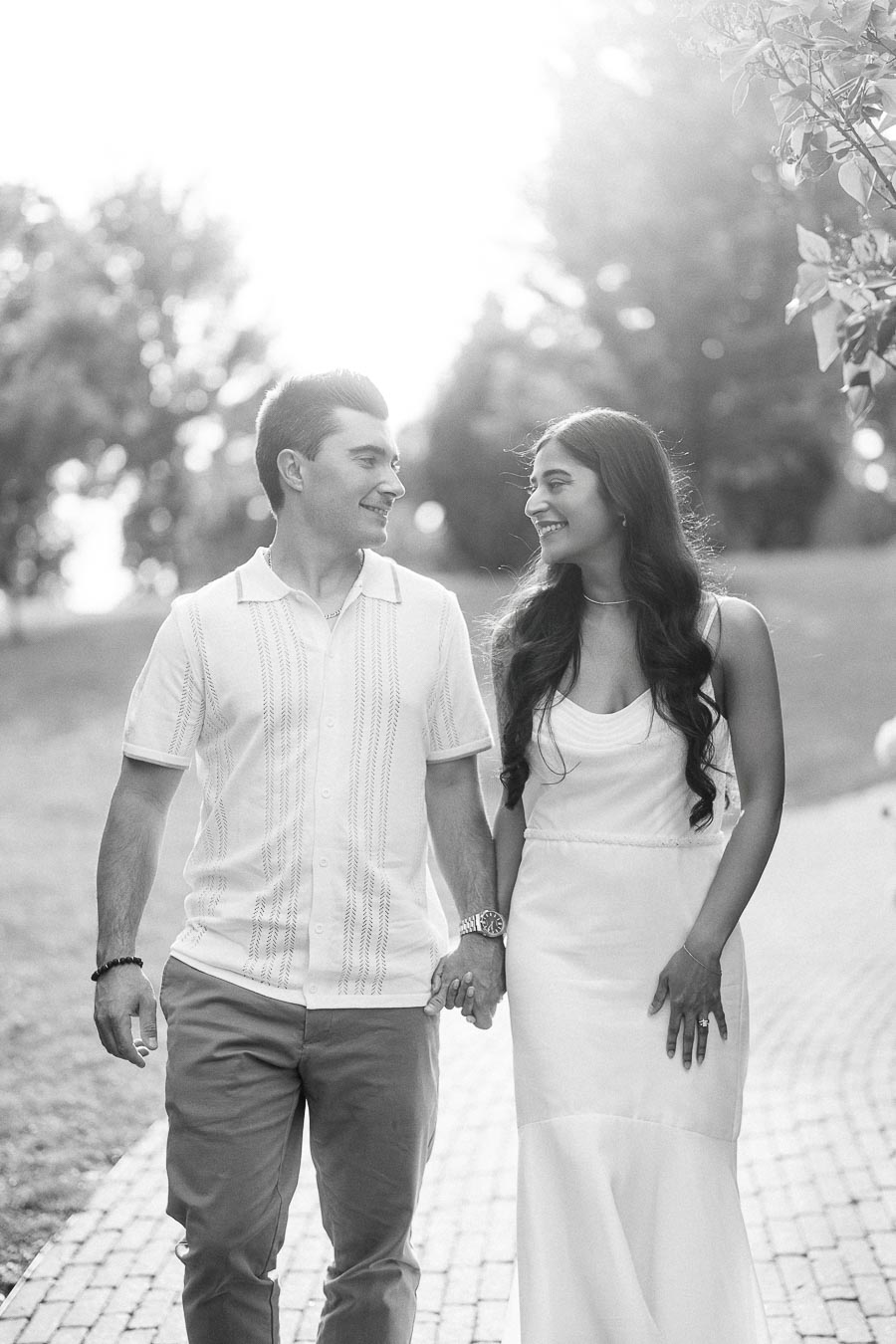 Sumbul and Brian walking hand in hand at Dundurn Castle in Hamilton