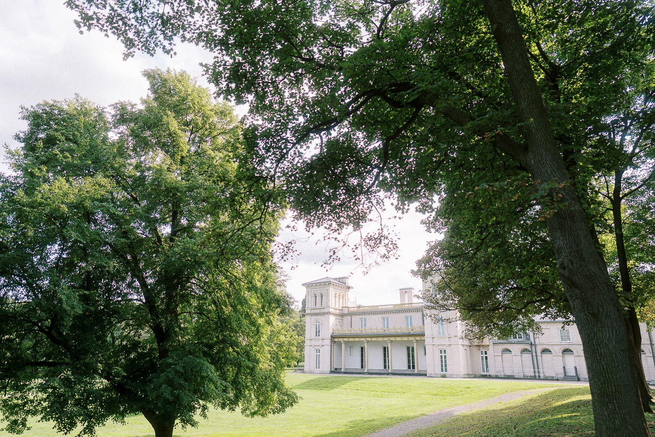 Dundurn Castle framed by mature trees in Hamilton, Ontario