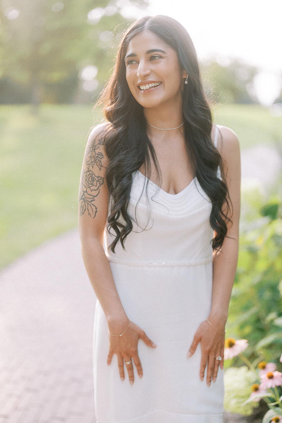Smiling bride-to-be in white dress during Dundurn Castle engagement session