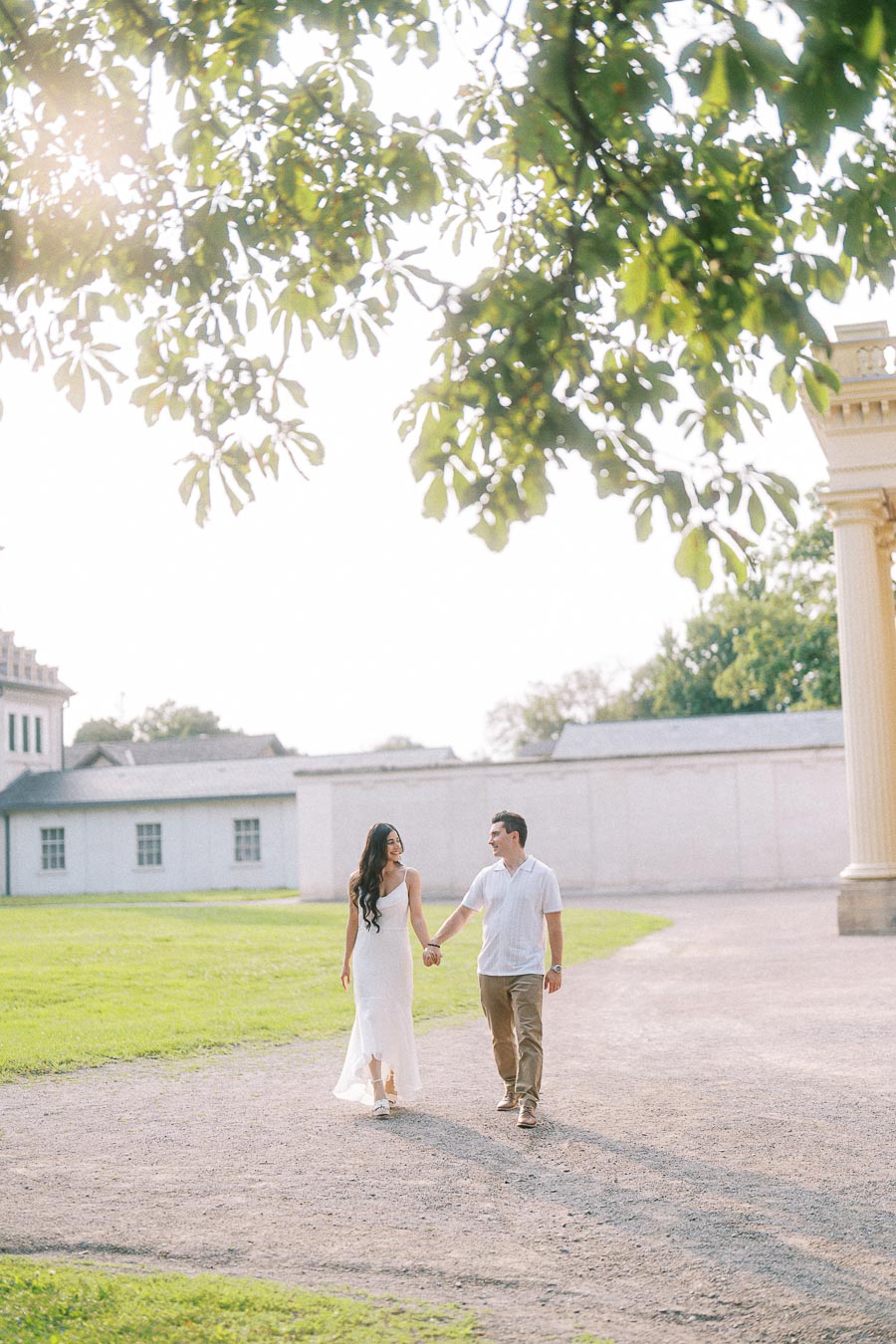 Sumbul and Brian walking hand in hand at Dundurn Castle in Hamilton