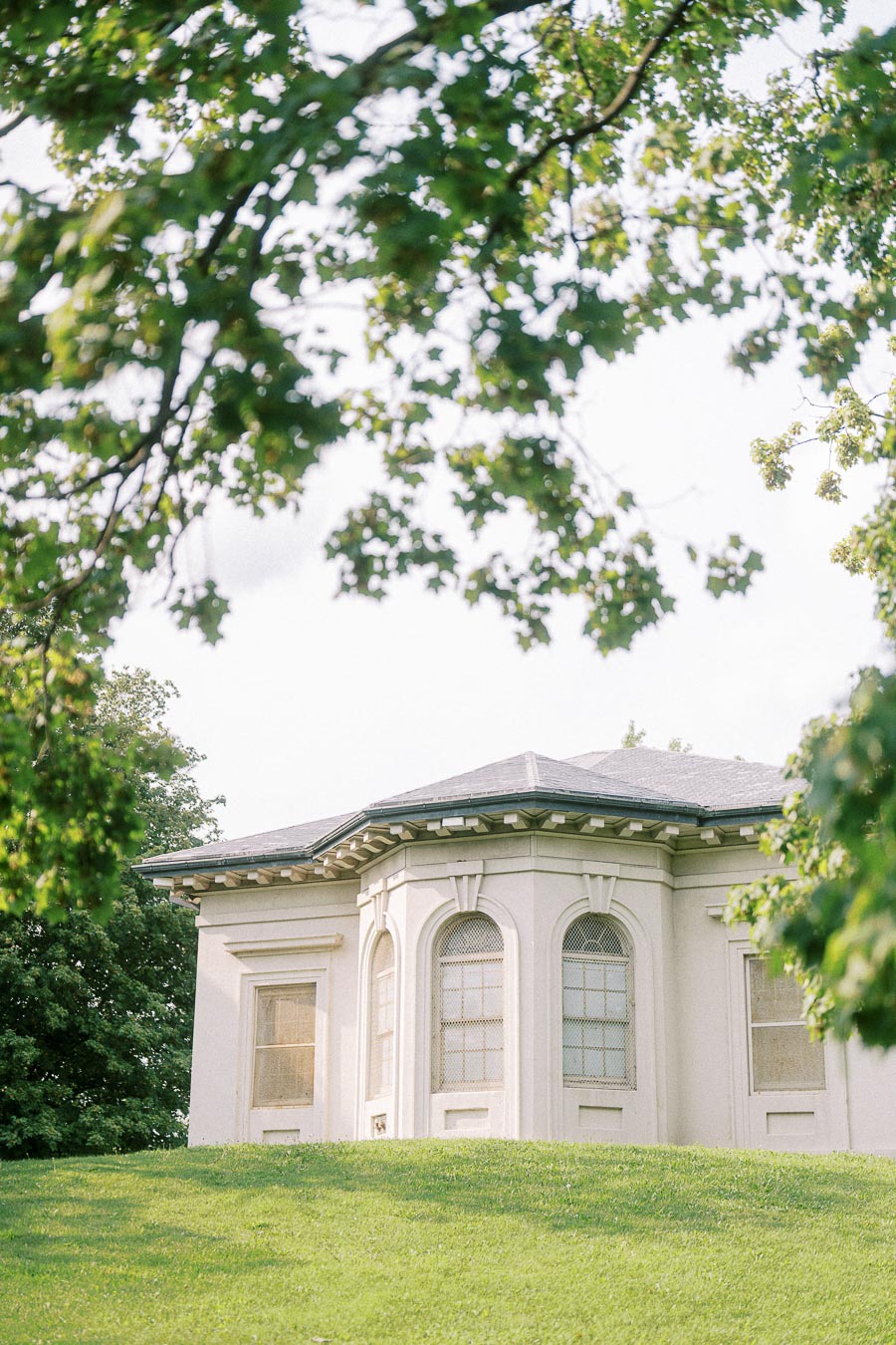 Dundurn Castle garden pavilion framed by leafy trees in Hamilton