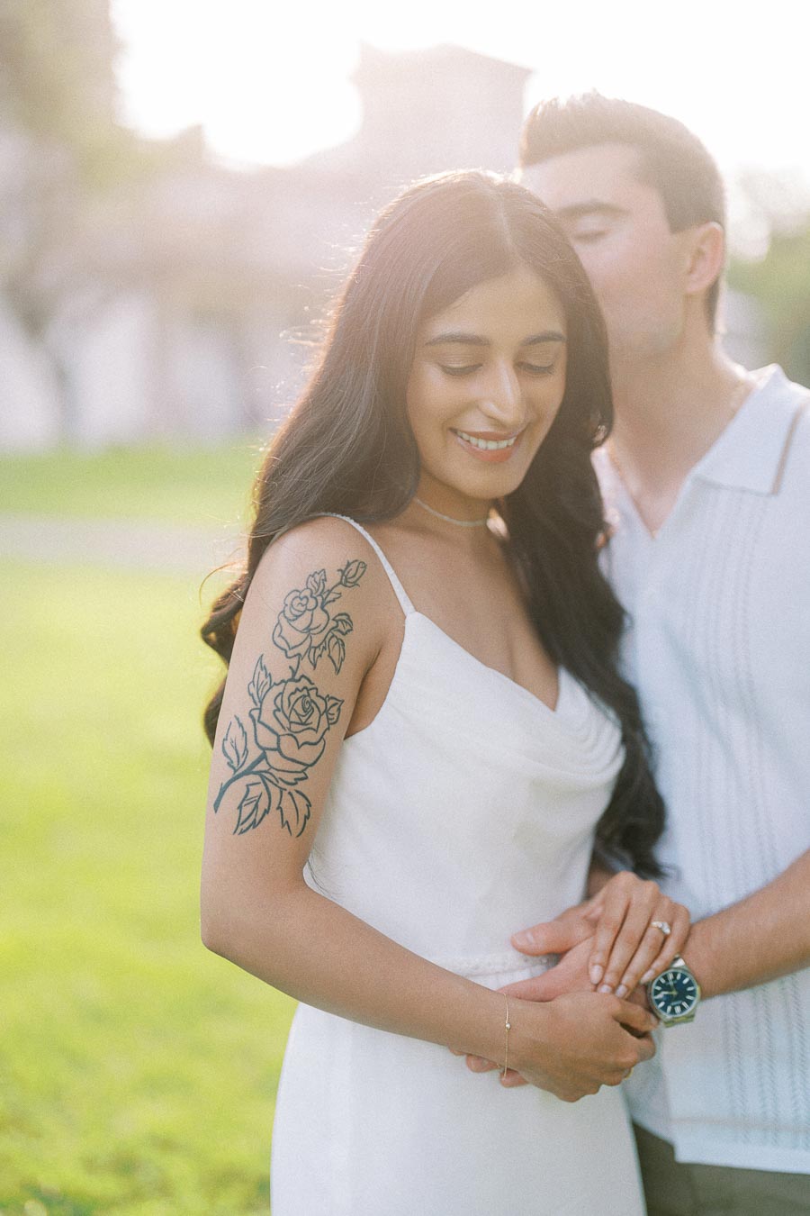 Sumbul and Brian embrace during a Dundurn Castle engagement photoshoot