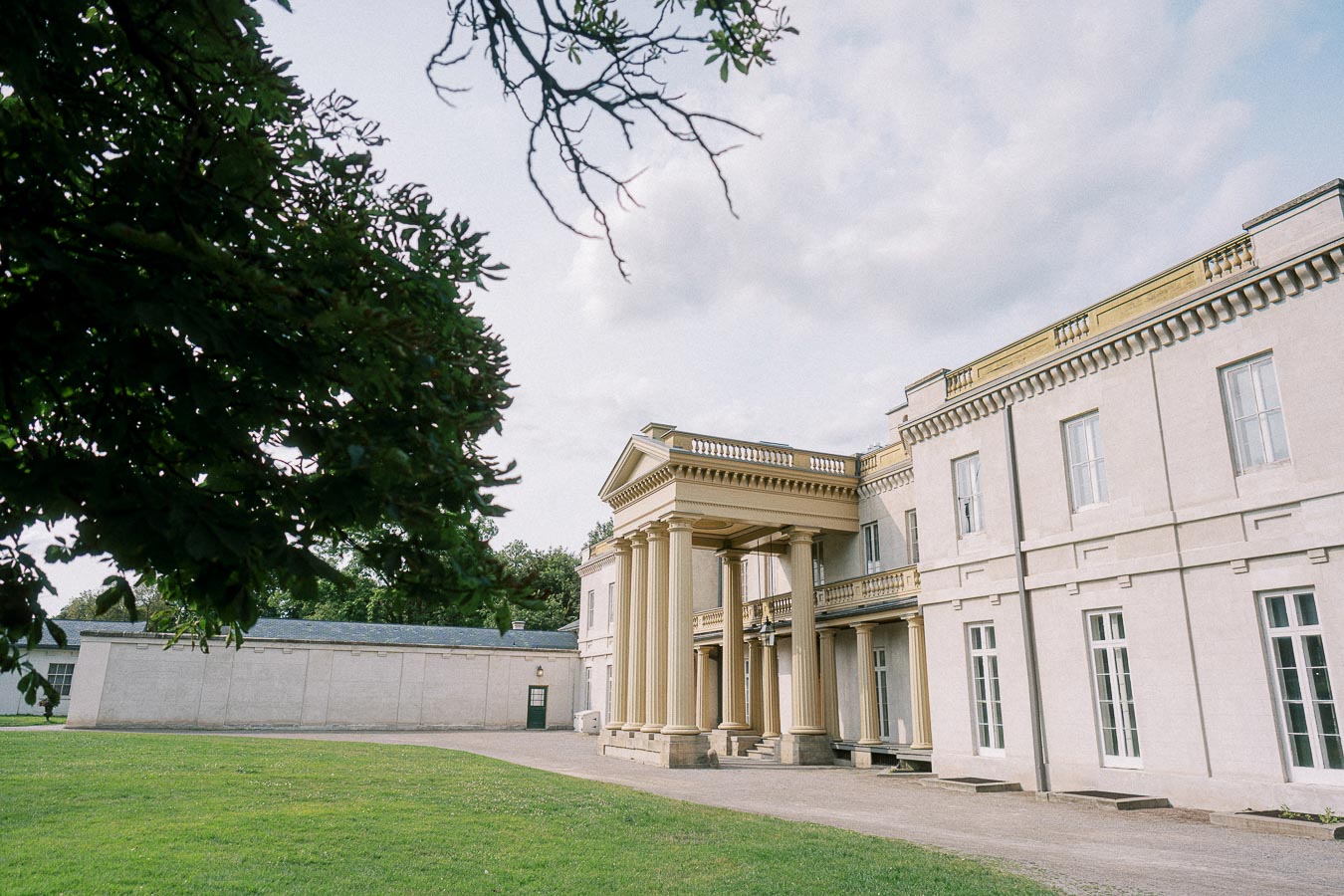 Dundurn Castle exterior with columned portico and lawn in Hamilton