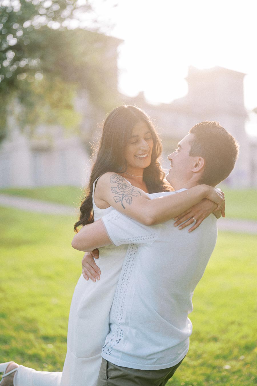 Sumbul and Brian embracing on the Dundurn Castle lawn in Hamilton