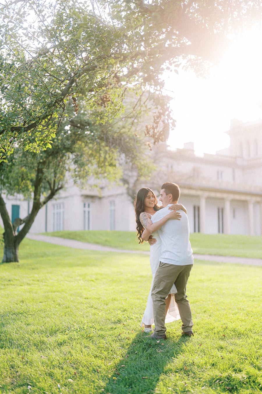 Sumbul and Brian embracing on the Dundurn Castle lawn in Hamilton