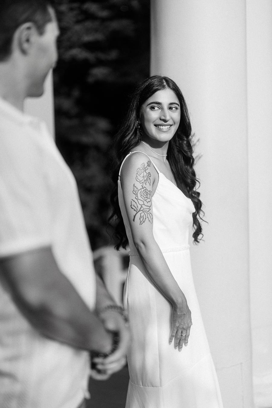 Sumbul smiling toward Brian during a Dundurn Castle engagement portrait