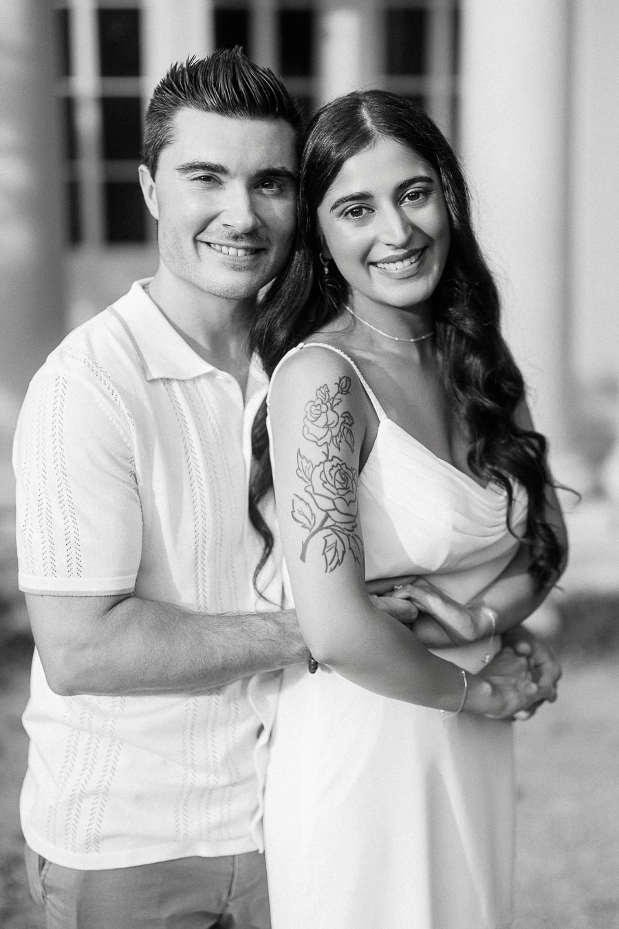 Sumbul and Brian smiling together during Dundurn Castle engagement photos