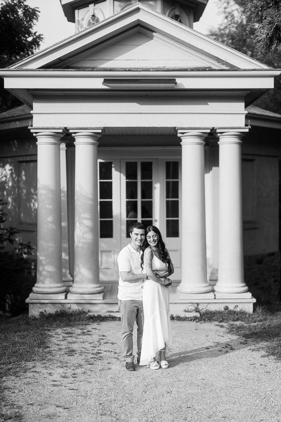 Sumbul and Brian standing before columns at Dundurn Castle in Hamilton