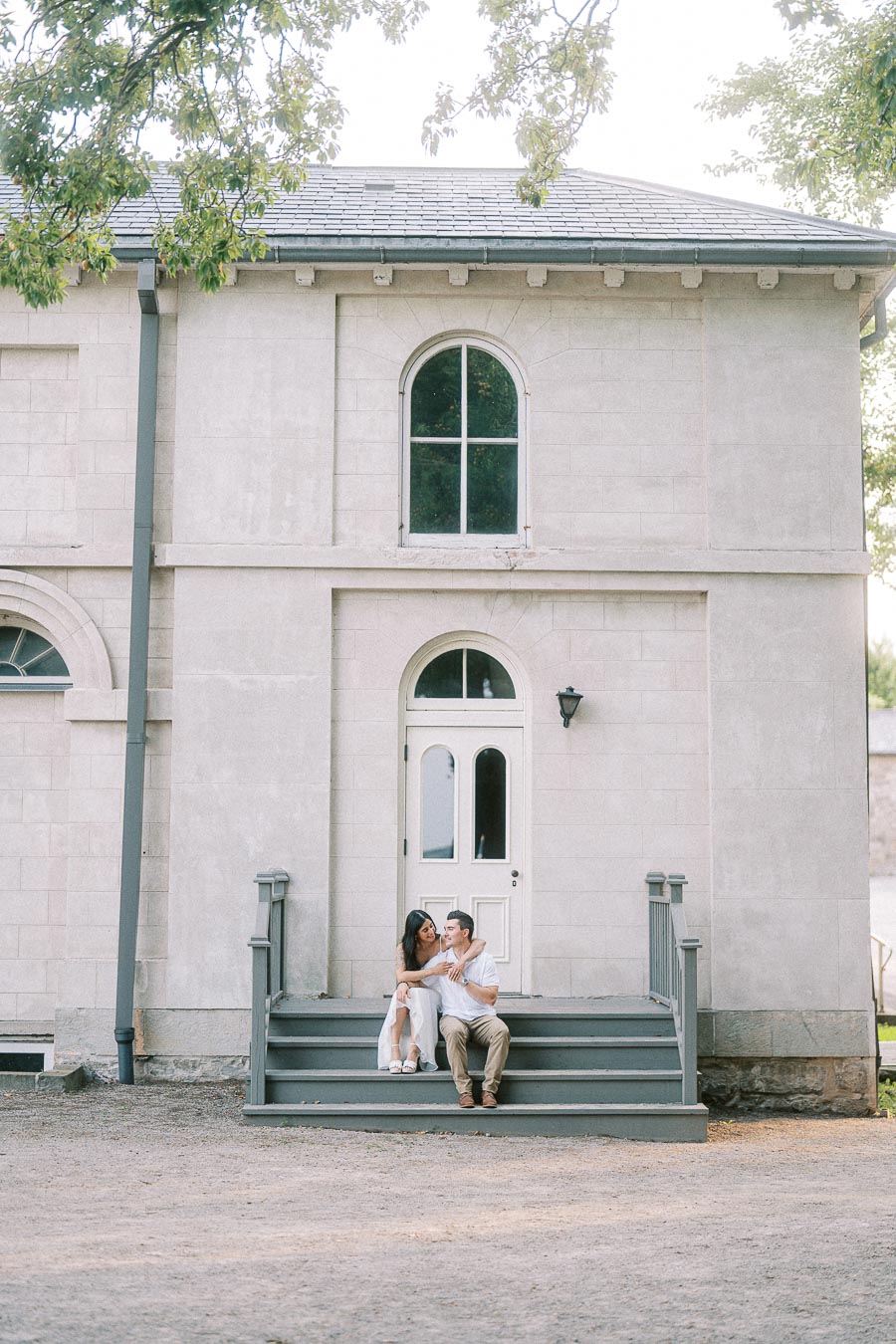 Sumbul and Brian sitting on Dundurn Castle steps in Hamilton