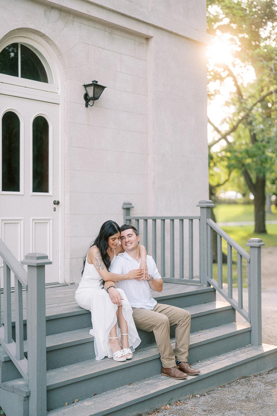 Sumbul and Brian sitting on Dundurn Castle steps in Hamilton