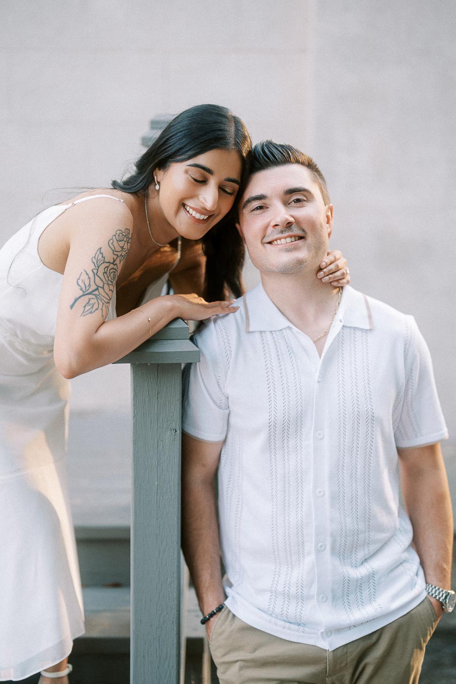 Sumbul and Brian smiling together during a Dundurn Castle engagement session