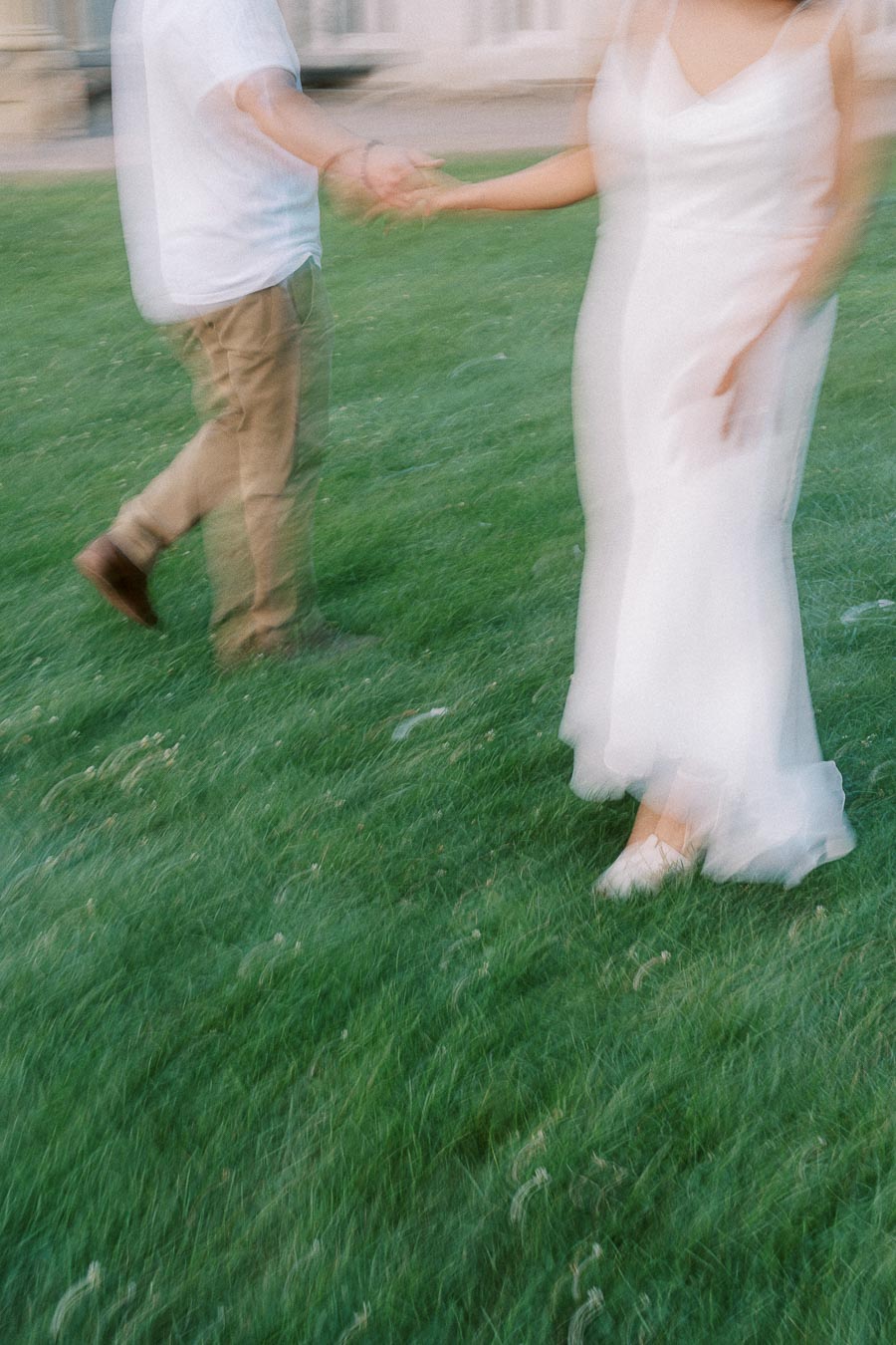 Motion-blurred couple holding hands on Dundurn Castle lawn