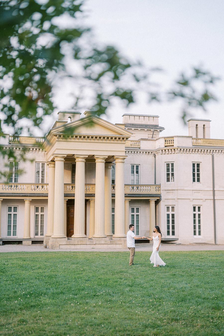 Sumbul and Brian standing on the lawn at Dundurn Castle in Hamilton