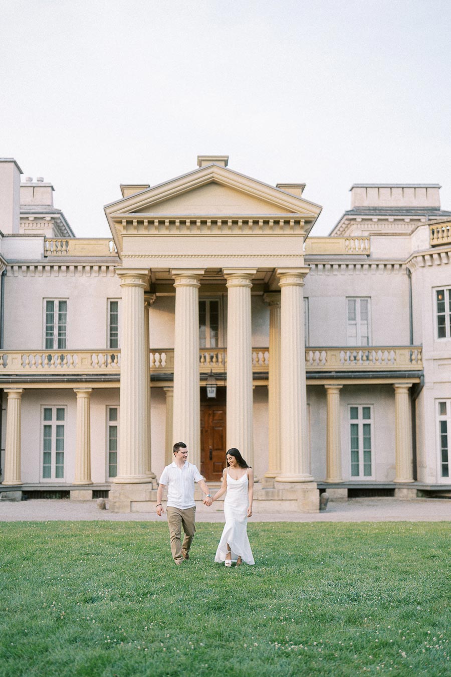 Sumbul and Brian walking on the lawn at Dundurn Castle in Hamilton