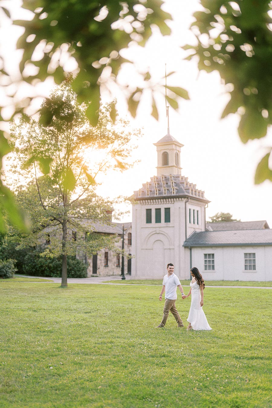 Sumbul and Brian walking on the Dundurn Castle lawn in Hamilton
