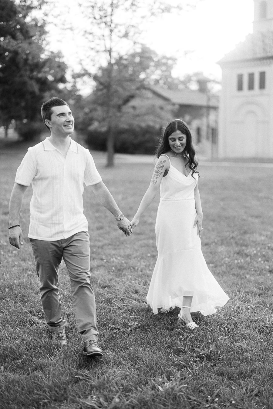 Sumbul and Brian walking hand in hand at Dundurn Castle in Hamilton